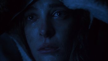 Movie still from “House of 1000 Corpses” (2003), directed by Rob Zombie – A woman's face in the dark; Close Up shot, Low angle