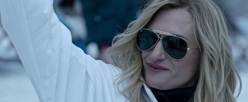 Movie still from “House of Gucci” (2021), directed by Ridley Scott – A person wearing sunglasses; Close Up shot, Over the shoulder angle