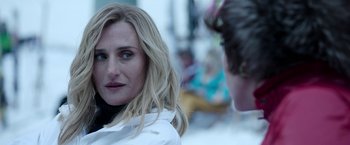 Movie still from “House of Gucci” (2021), directed by Ridley Scott – A woman is looking at another woman in a white jacket; Close Up shot, Over the shoulder angle