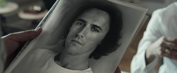 Movie still from “House of Gucci” (2021), directed by Ridley Scott – Black and white photograph of a man's face; Extreme Close Up shot, Low angle