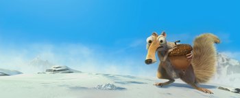 Movie still from “Ice Age: Continental Drift” (2012), directed by Michael Thurmeier – An ice age character is sitting in the sand; Medium shot, High angle