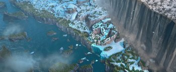 Movie still from “Ice Age: Continental Drift” (2012), directed by Michael Thurmeier – An aerial view of a frozen lake and a mountain range; Extreme Wide shot, Overhead angle