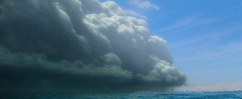 Movie still from “Ice Age: Continental Drift” (2012), directed by Michael Thurmeier – A large cloud formation over a body of water; Extreme Wide shot, Low angle