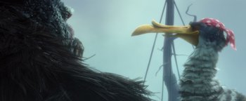 Movie still from “Ice Age: Continental Drift” (2012), directed by Michael Thurmeier – An image of a bird that is eating a banana peel; Wide shot, Low angle