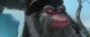 Movie still from “Ice Age: Continental Drift” (2012), directed by Michael Thurmeier – An animated monkey with a long beard is looking at the camera; Extreme Close Up shot, Low angle