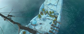 Movie still from “Ice Age: Continental Drift” (2012), directed by Michael Thurmeier – An overhead view of a frozen lake with a bunch of plants on it; Extreme Wide shot, Overhead angle