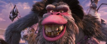 Movie still from “Ice Age: Continental Drift” (2012), directed by Michael Thurmeier – An animated monkey with a big smile on its face; Close Up shot, Low angle