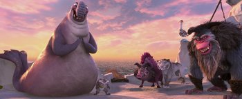 Movie still from “Ice Age: Continental Drift” (2012), directed by Michael Thurmeier – A group of animals that are standing in the sand; Wide shot, Low angle