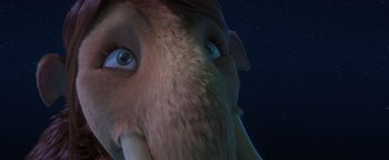 Movie still from “Ice Age: Continental Drift” (2012), directed by Michael Thurmeier – View of an elephant's face with the sky in the background; Extreme Close Up shot, Low angle
