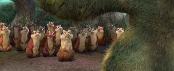 Movie still from “Ice Age: Continental Drift” (2012), directed by Michael Thurmeier – A group of animals that are standing in the dirt; Wide shot, Over the shoulder angle