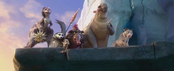 Movie still from “Ice Age: Continental Drift” (2012), directed by Michael Thurmeier – A group of animals that are standing in the dirt; Wide shot, High angle