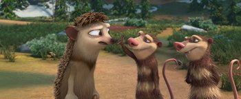 Movie still from “Ice Age: Continental Drift” (2012), directed by Michael Thurmeier – Two cartoon style animals standing next to each other; Close Up shot, Over the shoulder angle