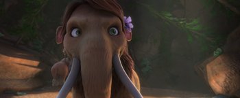 Movie still from “Ice Age: Continental Drift” (2012), directed by Michael Thurmeier – An animated elephant with a flower in its hair; Extreme Close Up shot, Over the shoulder angle