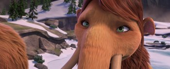 Movie still from “Ice Age: Continental Drift” (2012), directed by Michael Thurmeier – An animated elephant with green eyes and long hair; Extreme Close Up shot, High angle
