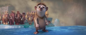 Movie still from “Ice Age: Continental Drift” (2012), directed by Michael Thurmeier – An animated scene of a meerkat standing in the water; Medium shot, High angle
