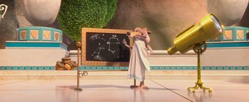 Movie still from “Ice Age: Continental Drift” (2012), directed by Michael Thurmeier – An image of an animated character pointing to a chalkboard; Wide shot, Low angle