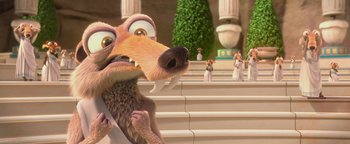 Movie still from “Ice Age: Continental Drift” (2012), directed by Michael Thurmeier – An ice age scene with a dog and some people in the background; Close Up shot, Low angle