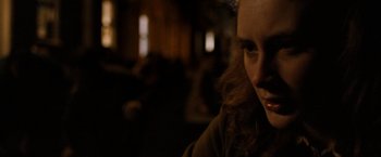 Movie still from “Hunger” (2008), directed by Steve McQueen – A person sitting in a room; Close Up shot, Over the shoulder angle