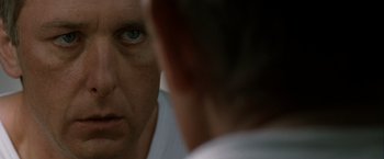 Movie still from “Hunger” (2008), directed by Steve McQueen – A person looking at a mirror; Close Up shot, Over the shoulder angle