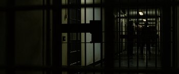 Movie still from “Hunger” (2008), directed by Steve McQueen – A view of a jail cell through a window; Extreme Wide shot, High angle
