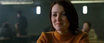 Movie still from “Hunger” (2008), directed by Steve McQueen – A person wearing an orange sweater; Close Up shot, Over the shoulder angle