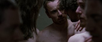 Movie still from “Hunger” (2008), directed by Steve McQueen – A man looking at himself in the mirror; Close Up shot, Over the shoulder angle