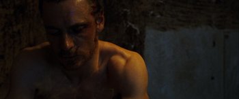 Movie still from “Hunger” (2008), directed by Steve McQueen – A man with a scar on his face and chest; Close Up shot, Low angle