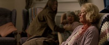 Movie still from “Hunger” (2008), directed by Steve McQueen – Two women are playing a game in a living room; Close Up shot, High angle