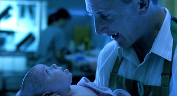 Movie still from “I Am Sam” (2001), directed by Jessie Nelson – An older man and a young child in a hospital room; Close Up shot, Over the shoulder angle