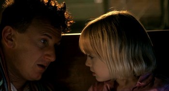 Movie still from “I Am Sam” (2001), directed by Jessie Nelson – A man and a little girl looking at each other; Close Up shot, Over the shoulder angle