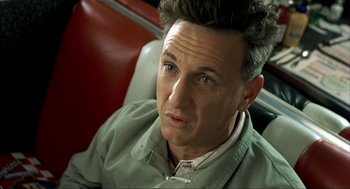 Movie still from “I Am Sam” (2001), directed by Jessie Nelson – A person sitting in a chair; Close Up shot, High angle