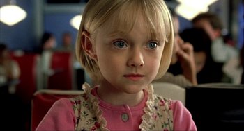 Movie still from “I Am Sam” (2001), directed by Jessie Nelson – A little girl with blonde hair wearing a pink shirt; Close Up shot, High angle