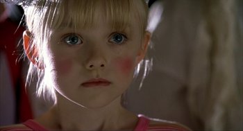 Movie still from “I Am Sam” (2001), directed by Jessie Nelson – A young girl with blue eyes; Close Up shot, High angle