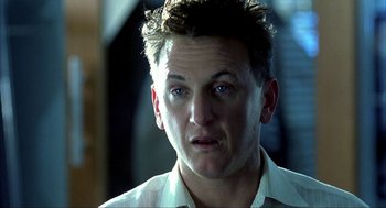 Movie still from “I Am Sam” (2001), directed by Jessie Nelson – A person wearing a white shirt; Close Up shot, Over the shoulder angle