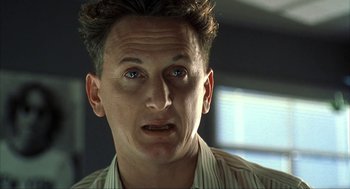 Movie still from “I Am Sam” (2001), directed by Jessie Nelson – A person wearing a dress shirt; Close Up shot, Low angle