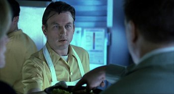 Movie still from “I Am Sam” (2001), directed by Jessie Nelson – A man sitting in front of a plate of food; Close Up shot, Over the shoulder angle