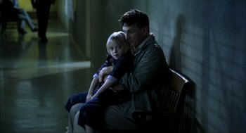 Movie still from “I Am Sam” (2001), directed by Jessie Nelson – A man and a little girl sitting on a bench; Medium shot, Over the shoulder angle