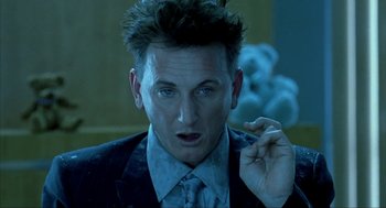 Movie still from “I Am Sam” (2001), directed by Jessie Nelson – A person wearing a suit and tie; Close Up shot, Low angle