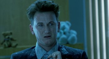 Movie still from “I Am Sam” (2001), directed by Jessie Nelson – A person wearing a suit and tie; Close Up shot, Low angle