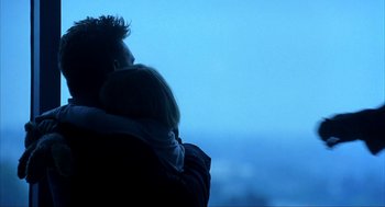 Movie still from “I Am Sam” (2001), directed by Jessie Nelson – A man and a woman are looking out at the sky; Medium shot, Over the shoulder angle