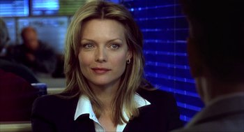 Movie still from “I Am Sam” (2001), directed by Jessie Nelson – A person wearing a suit and tie; Close Up shot, Over the shoulder angle