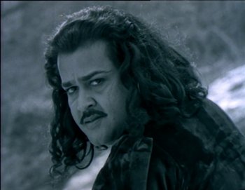 Movie still from “Iruvar” (1997), directed by Mani Ratnam – Close Up shot, Low angle