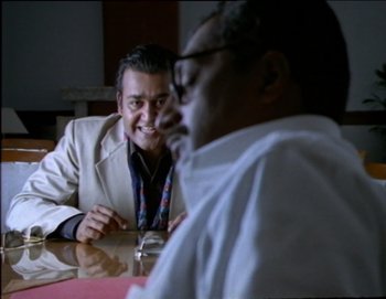 Movie still from “Iruvar” (1997), directed by Mani Ratnam – Medium shot, Over the shoulder angle