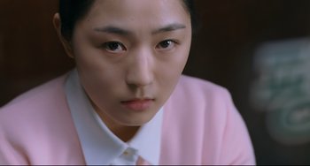 Movie still from “I Saw the Devil” (2010), directed by Jee-woon Kim – A person wearing a shirt and tie; Close Up shot, Over the shoulder angle