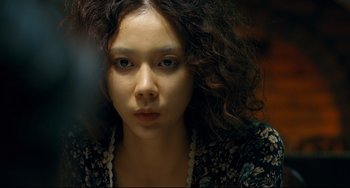Movie still from “I Saw the Devil” (2010), directed by Jee-woon Kim – A person wearing a necklace; Close Up shot, Over the shoulder angle