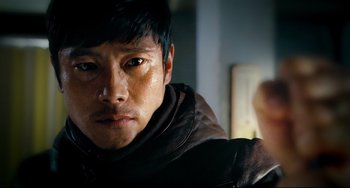 Movie still from “I Saw the Devil” (2010), directed by Jee-woon Kim – A person wearing a leather jacket; Close Up shot, Low angle