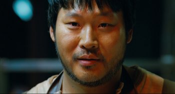 Movie still from “I Saw the Devil” (2010), directed by Jee-woon Kim – A person with a beard; Close Up shot, Low angle