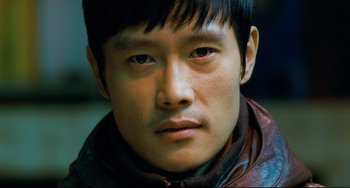 Movie still from “I Saw the Devil” (2010), directed by Jee-woon Kim – A person wearing a jacket; Close Up shot, High angle