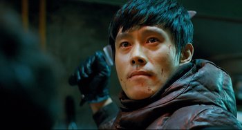 Movie still from “I Saw the Devil” (2010), directed by Jee-woon Kim – A man in a leather jacket with blood all over his face; Close Up shot, Low angle