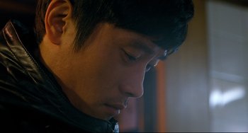 Movie still from “I Saw the Devil” (2010), directed by Jee-woon Kim – A person looking down at his face; Close Up shot, Over the shoulder angle